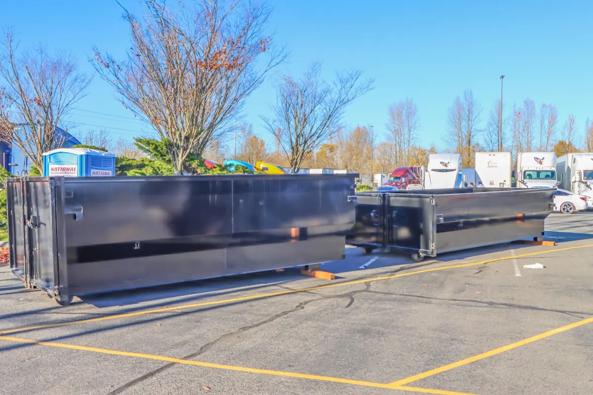 Professional dumpster rental service with roll-off container on residential driveway in Rancho Cucamonga